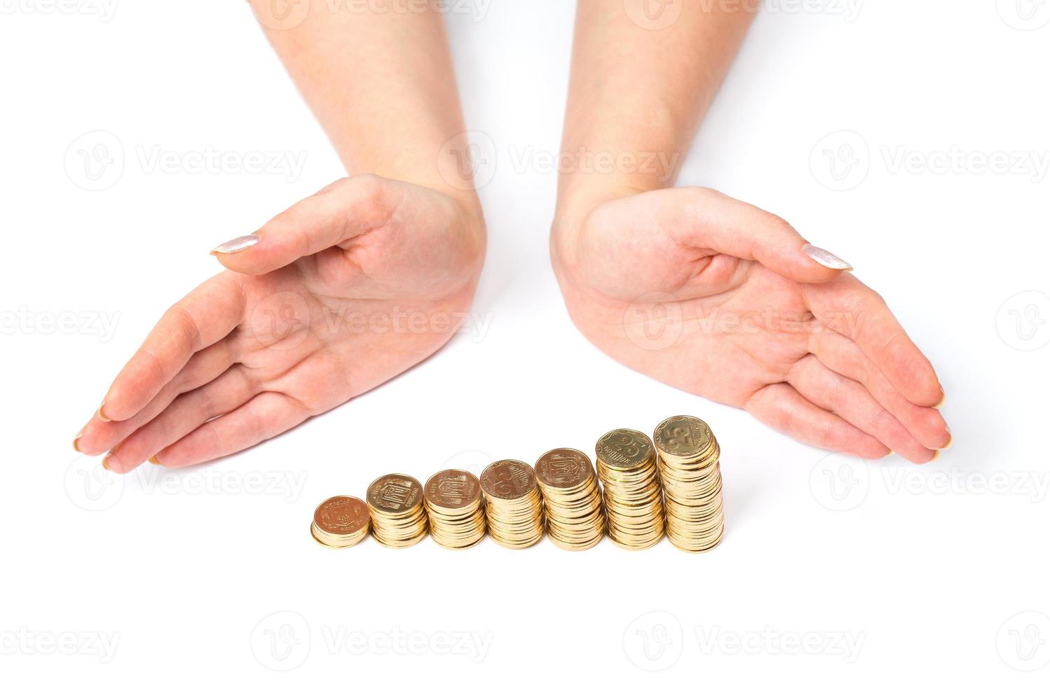 Hands and coins on white photo