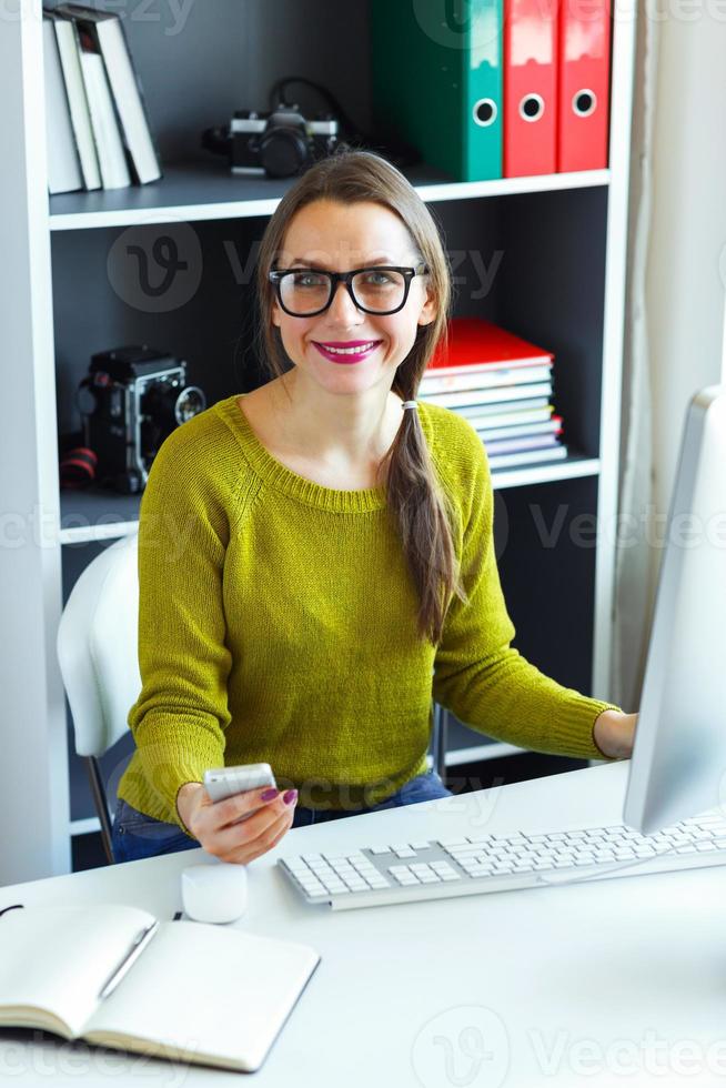 Young woman working from home - modern business concept photo