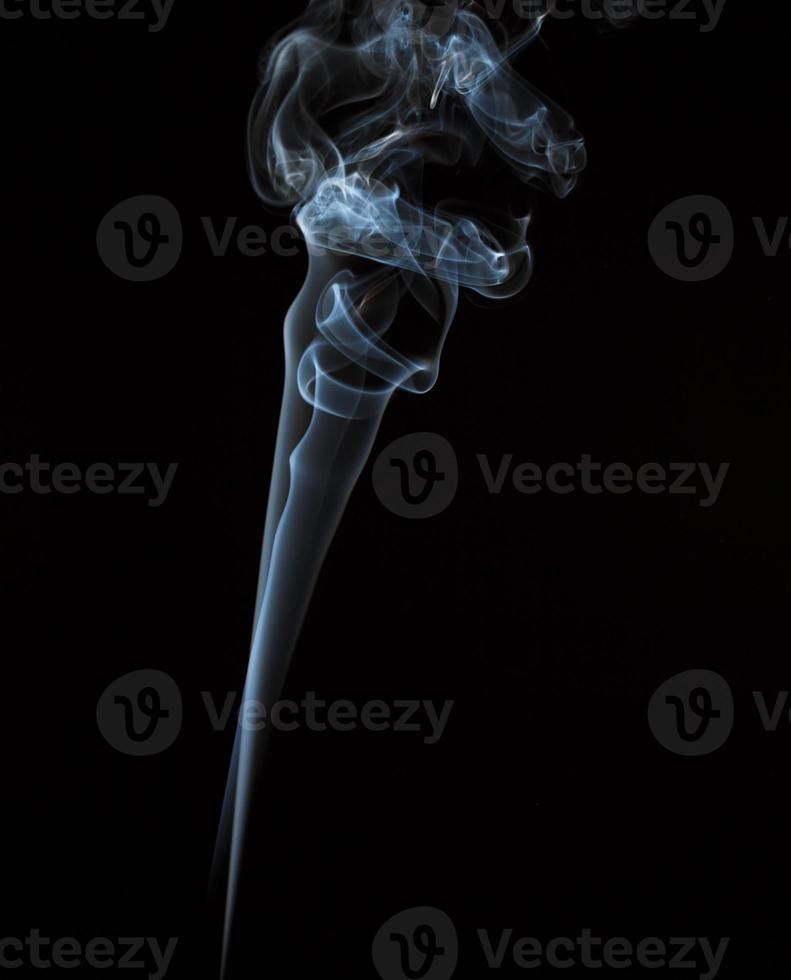 Abstract light smoke on dark background photo