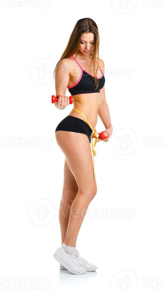 Beautiful sport woman with dumbbells doing sport exercise, isolated on white photo