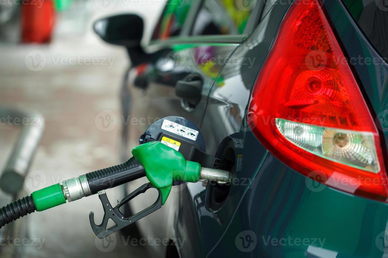 Car refueling on a petrol station in winter close up photo