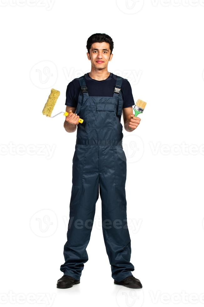 Repairman Arab nationality in the construction overalls on a white background photo