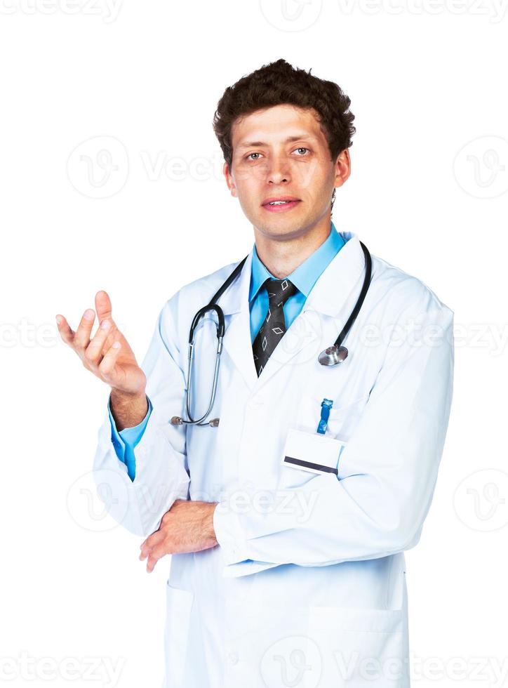 Portrait of a male doctor showing finger at you on white photo