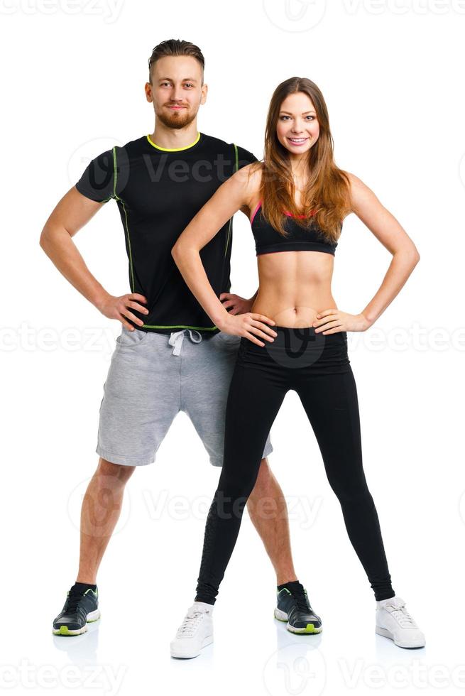 Athletic man and woman after fitness exercise on the white photo