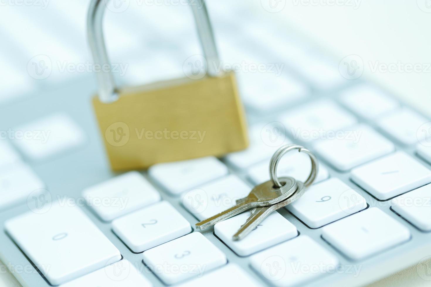 Security lock on white computer keyboard photo