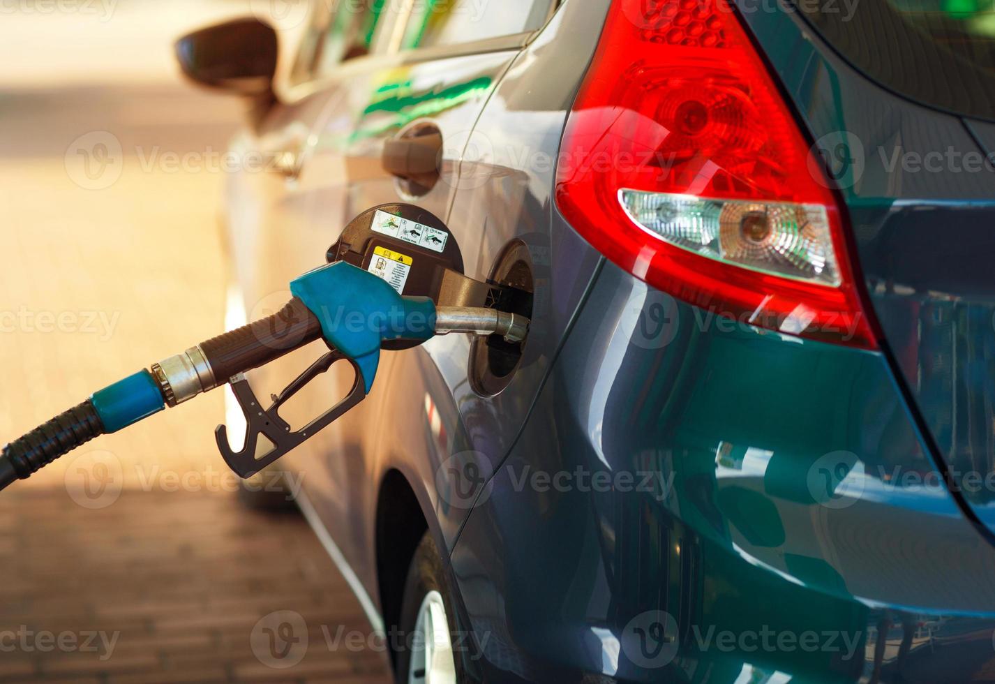 Car refueling on a petrol station close up photo