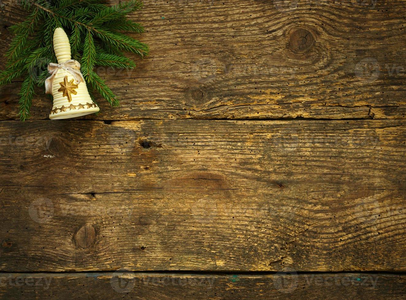 Christmas tree branches with cones and christmas decorations on wooden texture ready for your design photo