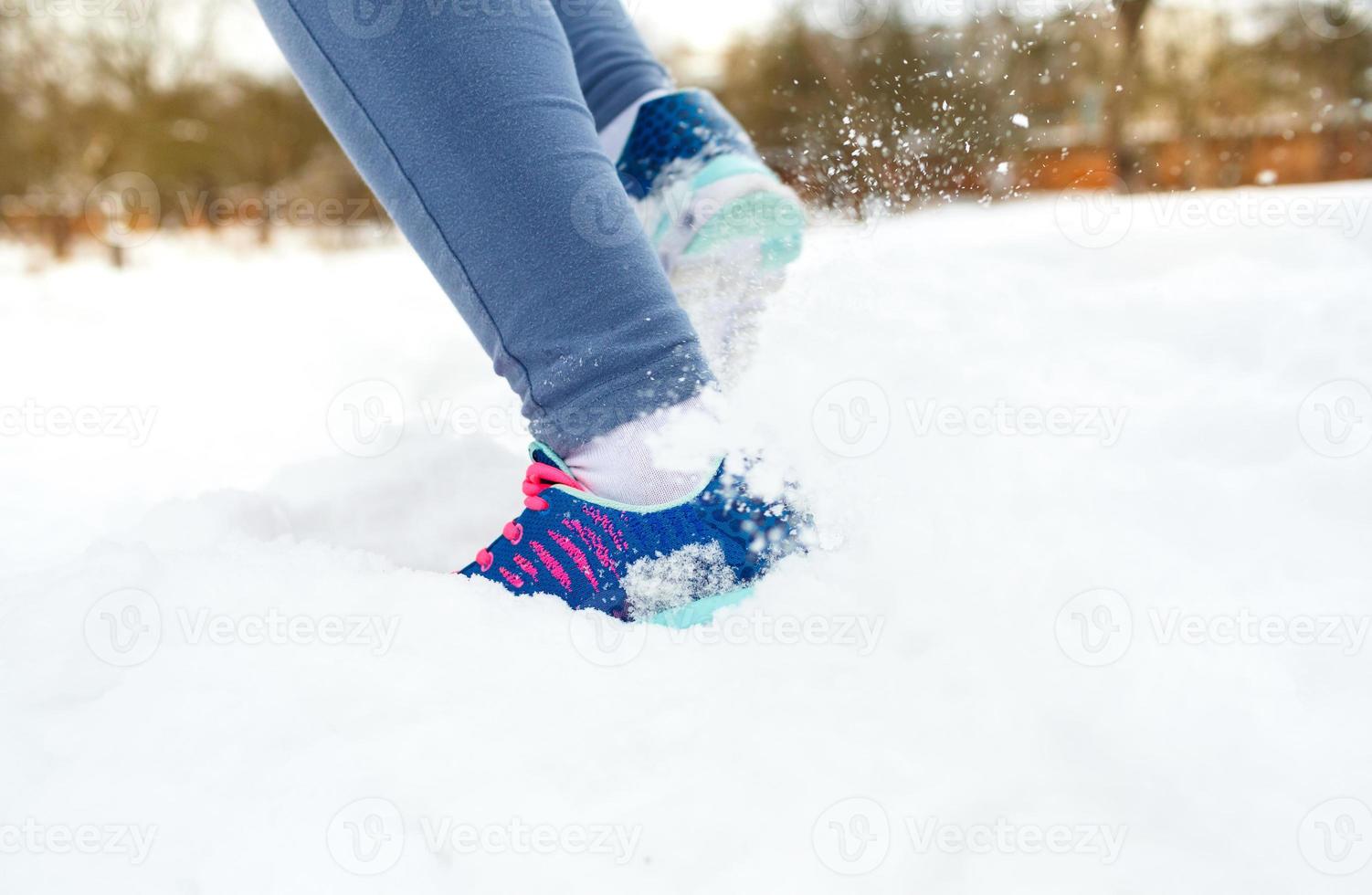 Runner getting ready for jogging outdoors in winter photo