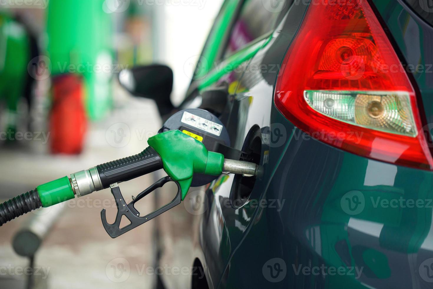 Car refueling on a petrol station in winter photo