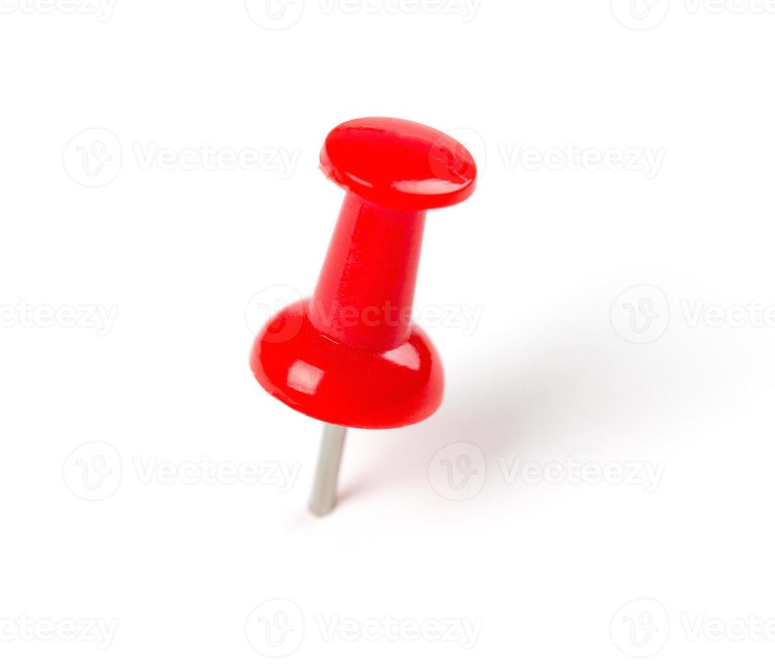 Red Push pin on white background photo