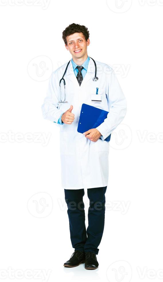Portrait of a smiling male doctor holding a notepad and finger up on white photo