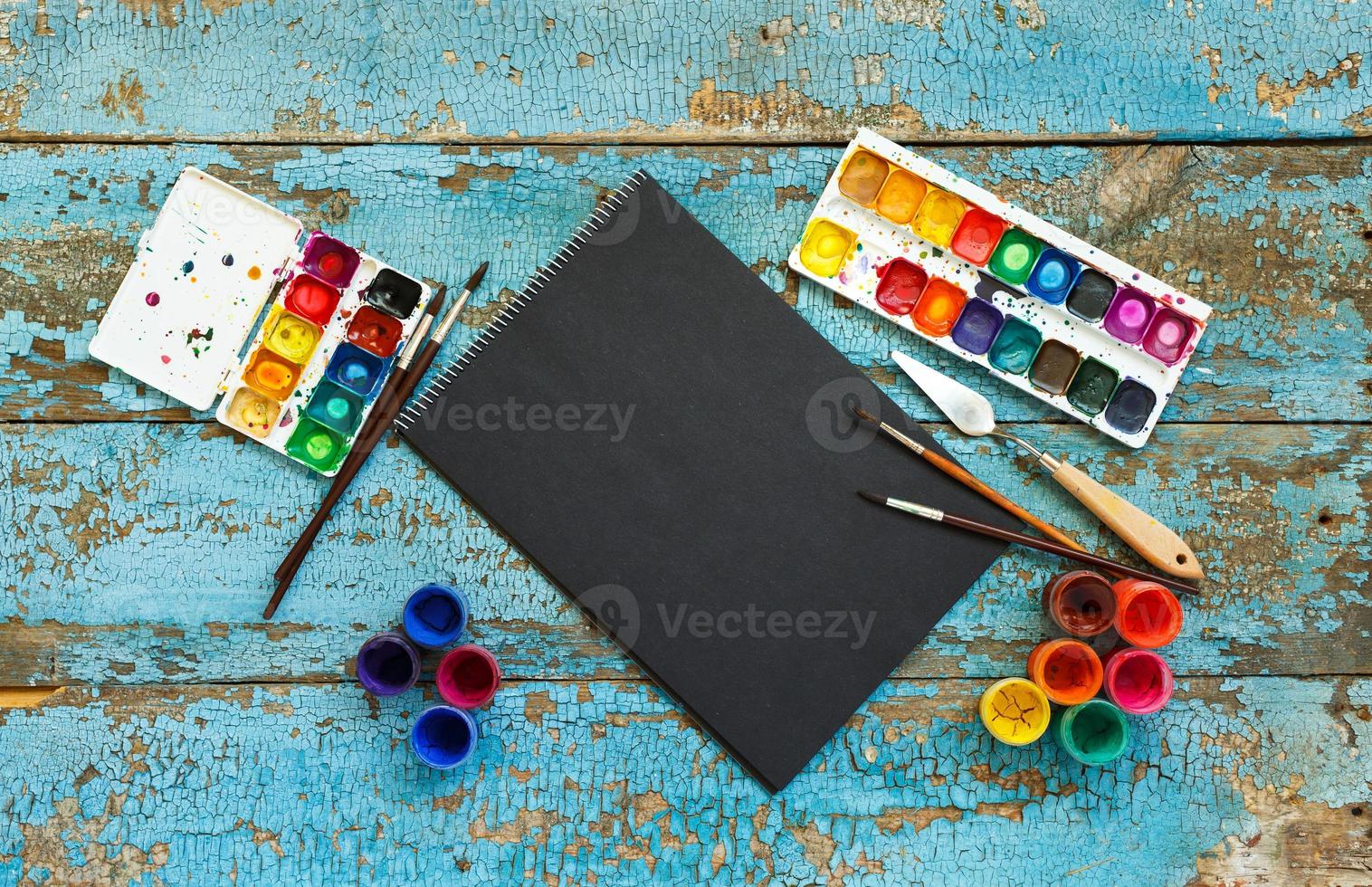 Art painting materials on wooden background photo