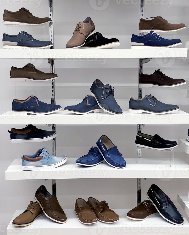 Background with shoes on shelves of shop photo