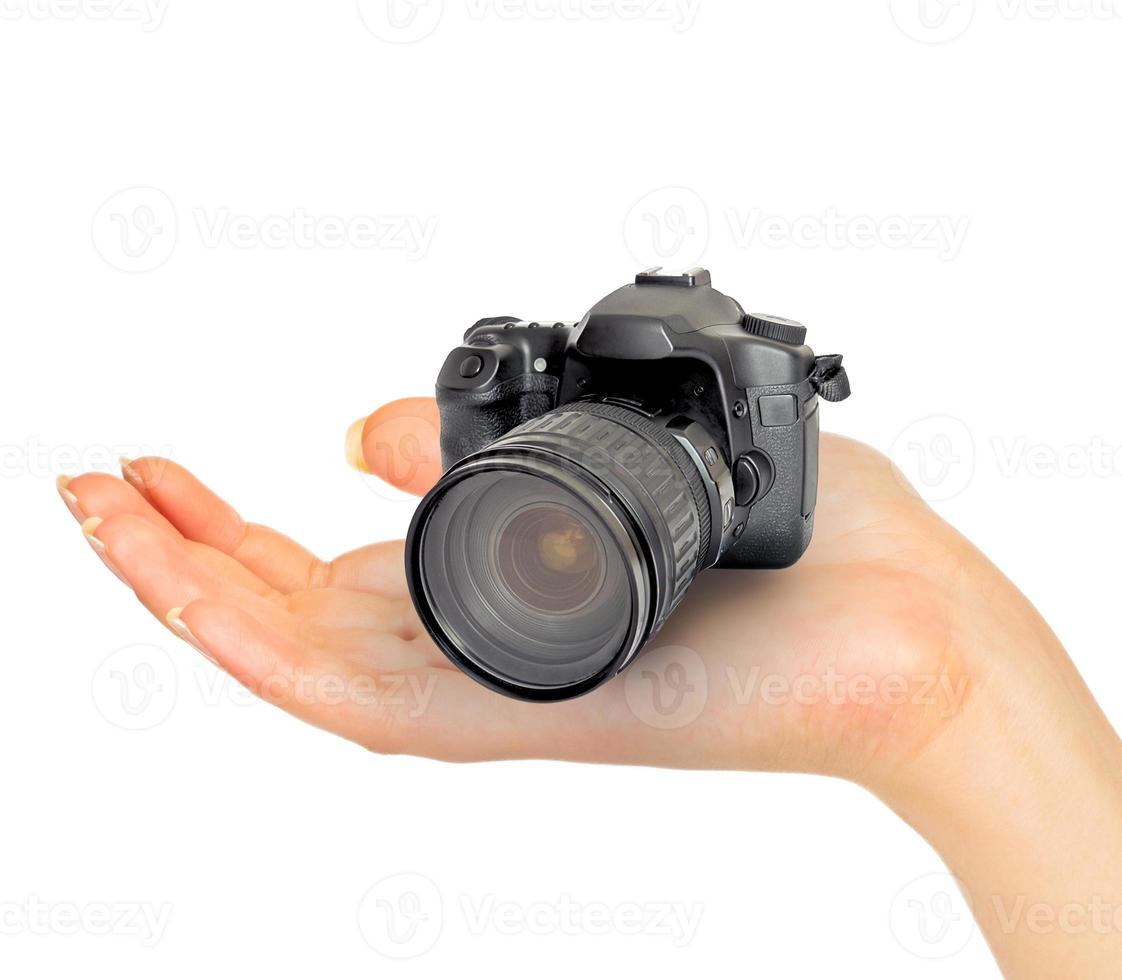 Digital camera in hand photo