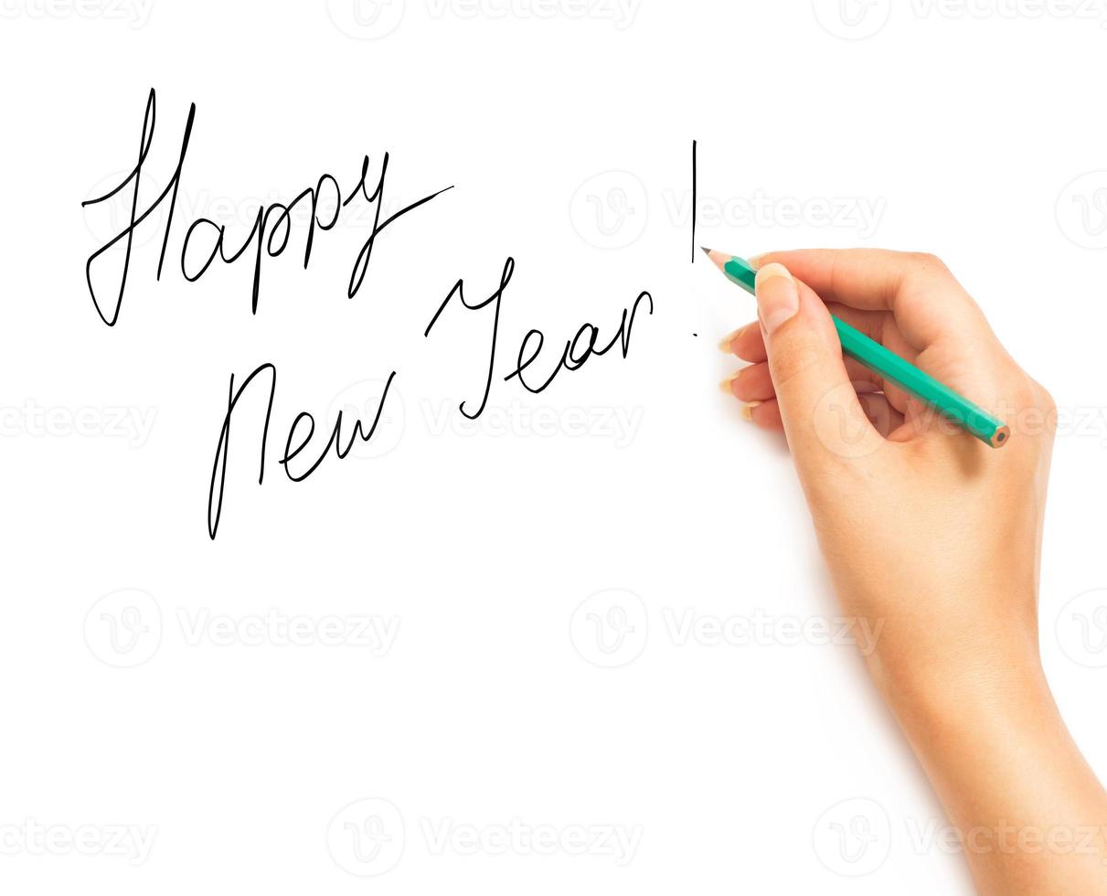 mujer mano participación un lápiz y escritura contento nuevo año en un blanco blanco foto