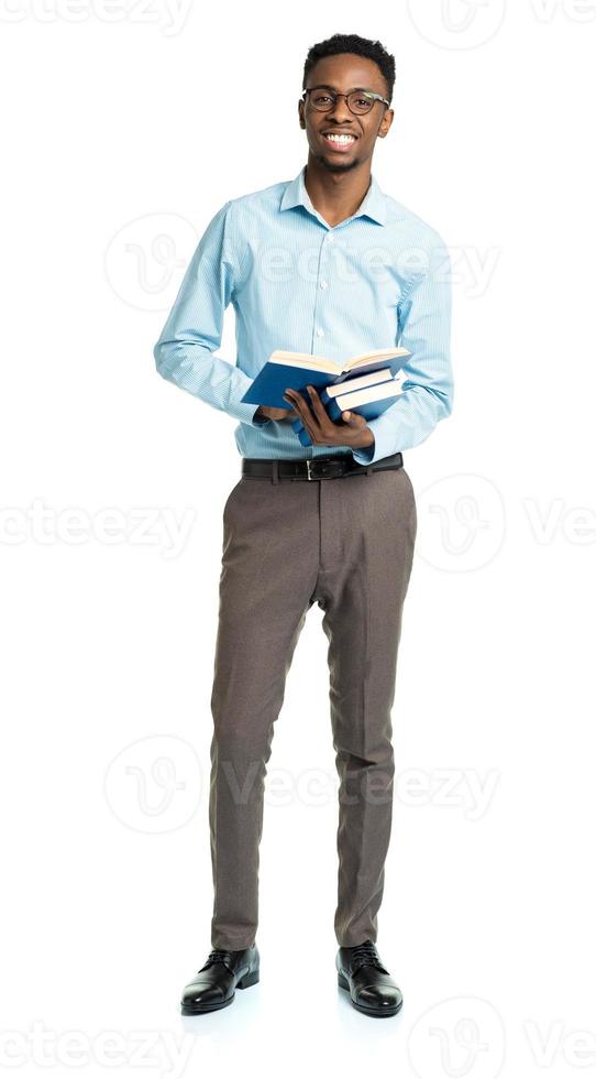 Happy african american college student with books in his hands photo