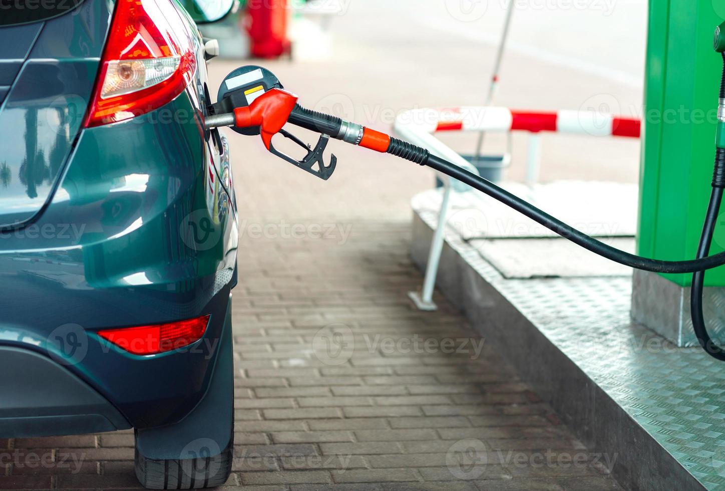 Car refueling on a petrol station close up photo