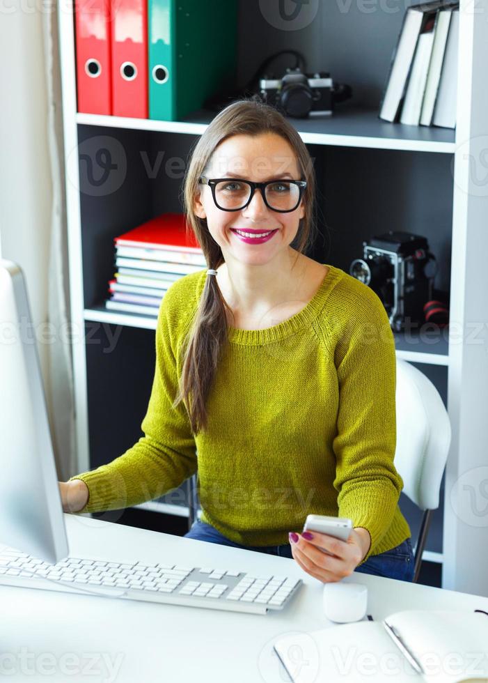 Young woman working from home - modern business concept photo