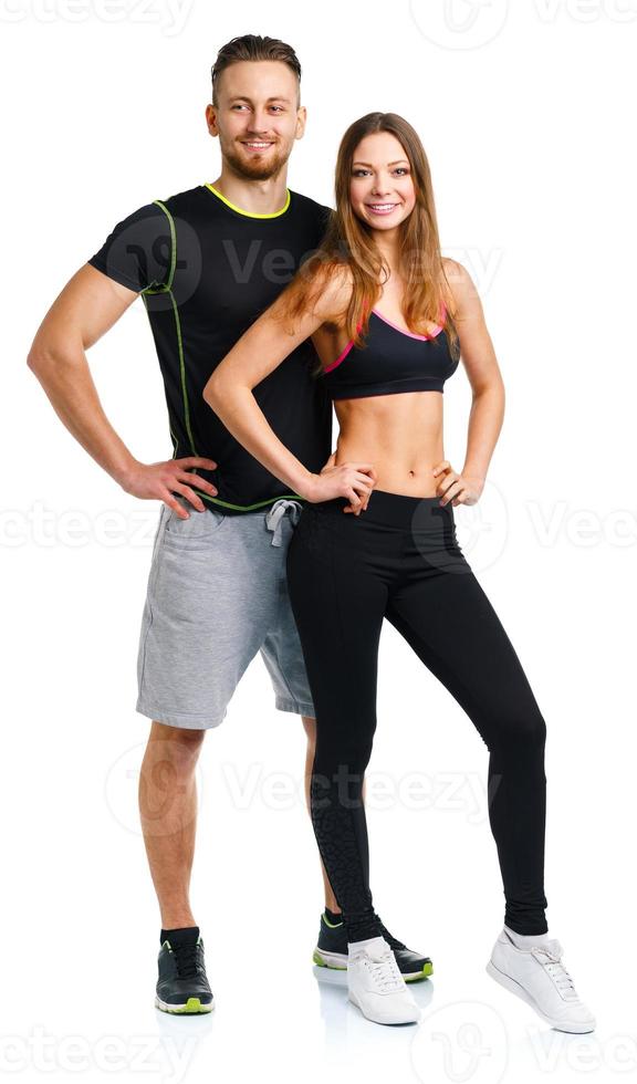 Sport couple - man and woman after fitness exercise on the white photo