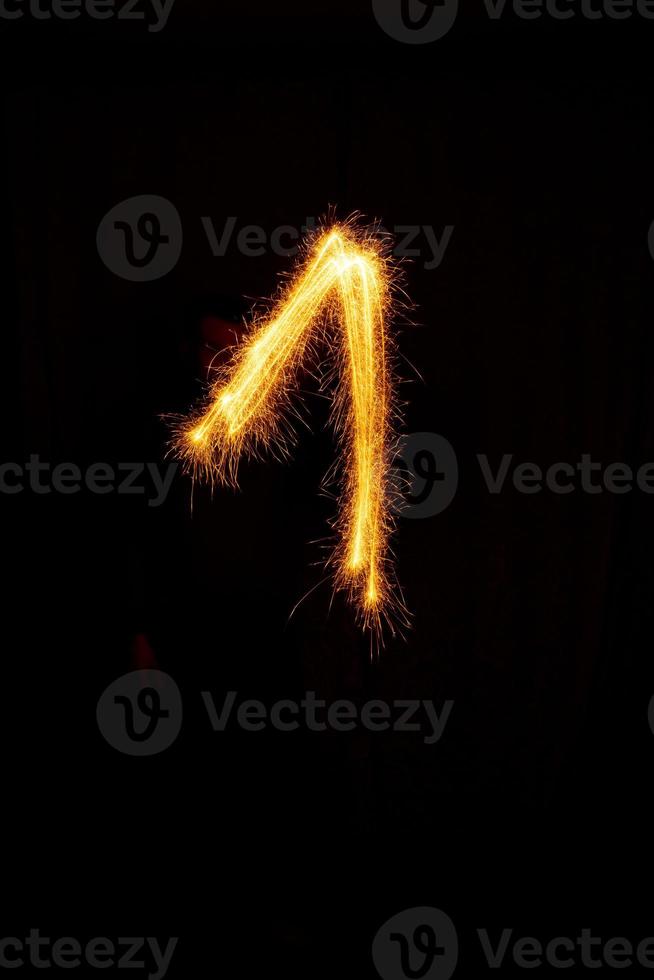 made with sAlphabet element made with sparklers ready for your inscriptions on black background photo