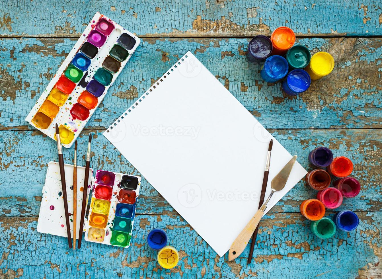 Art painting materials on wooden background photo