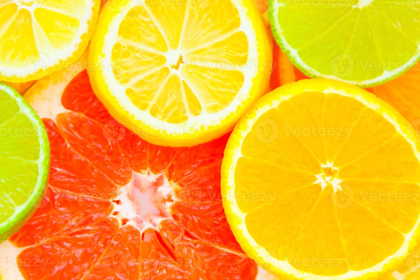 Mixed citrus fruit background photo