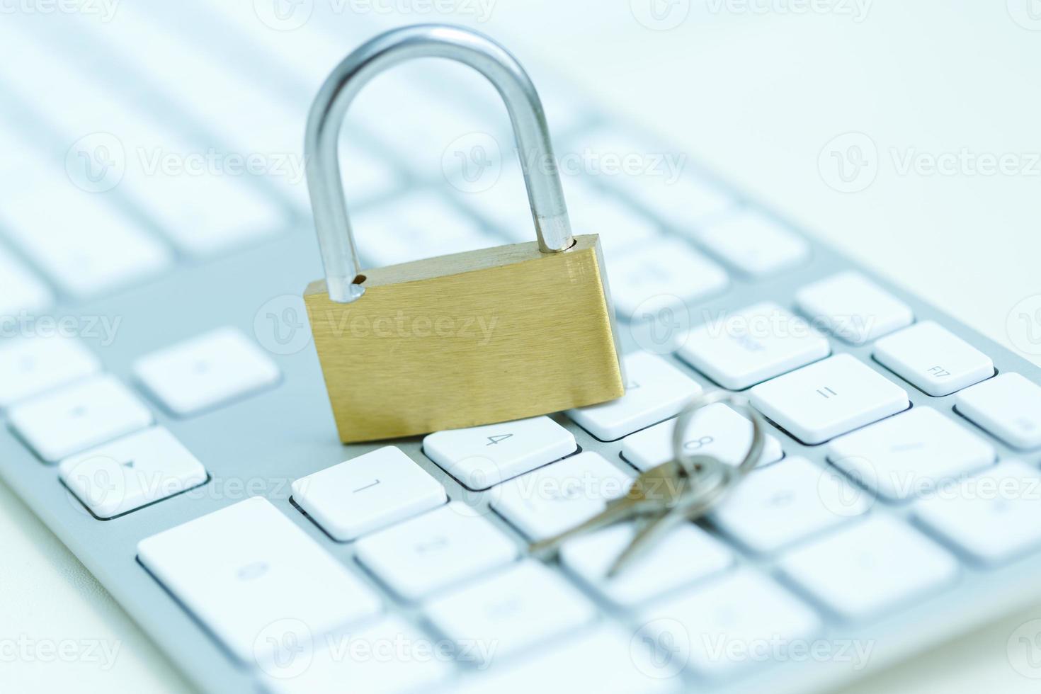 Security lock on white computer keyboard photo