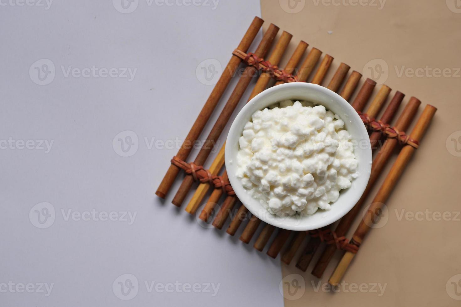 cottage cheese in a bowl on table photo