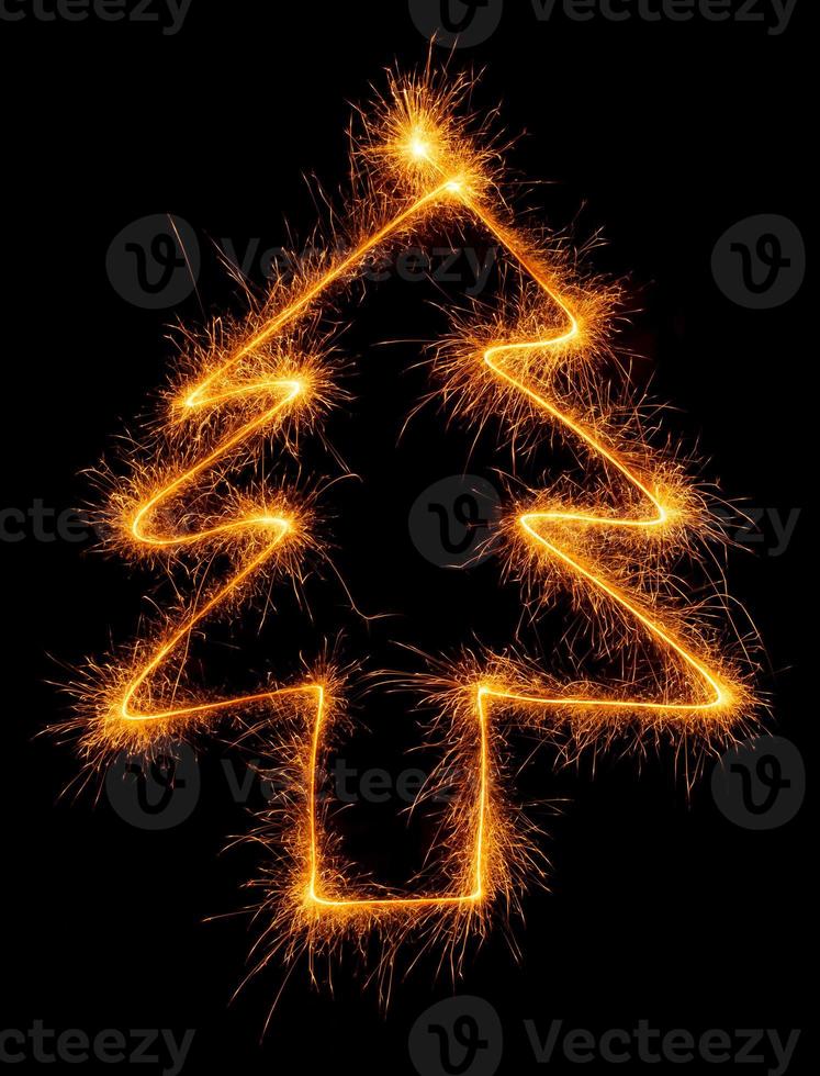 Tree made with sparklers ready for your inscriptions on black background photo