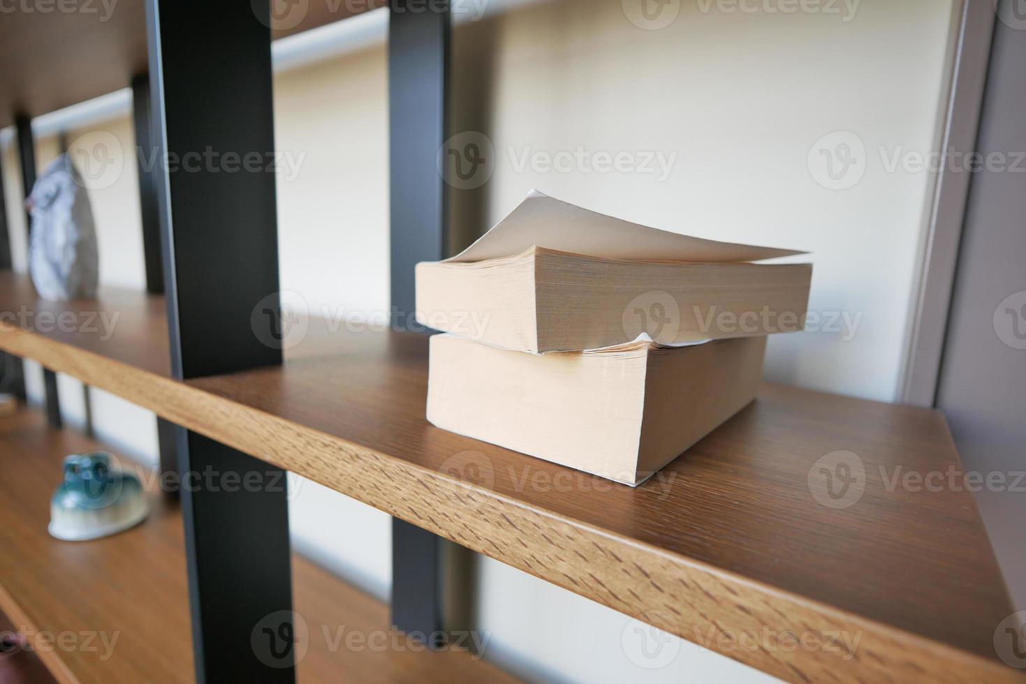 stack of books on wooden table photo