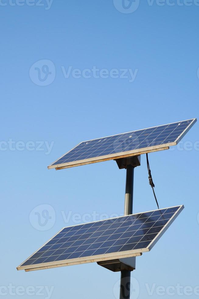 Solar panel against blue background photo