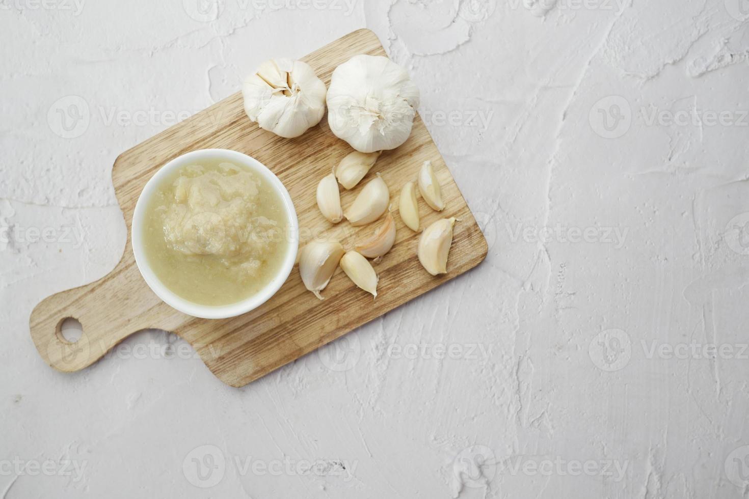 top view of garlic paste on white background, photo