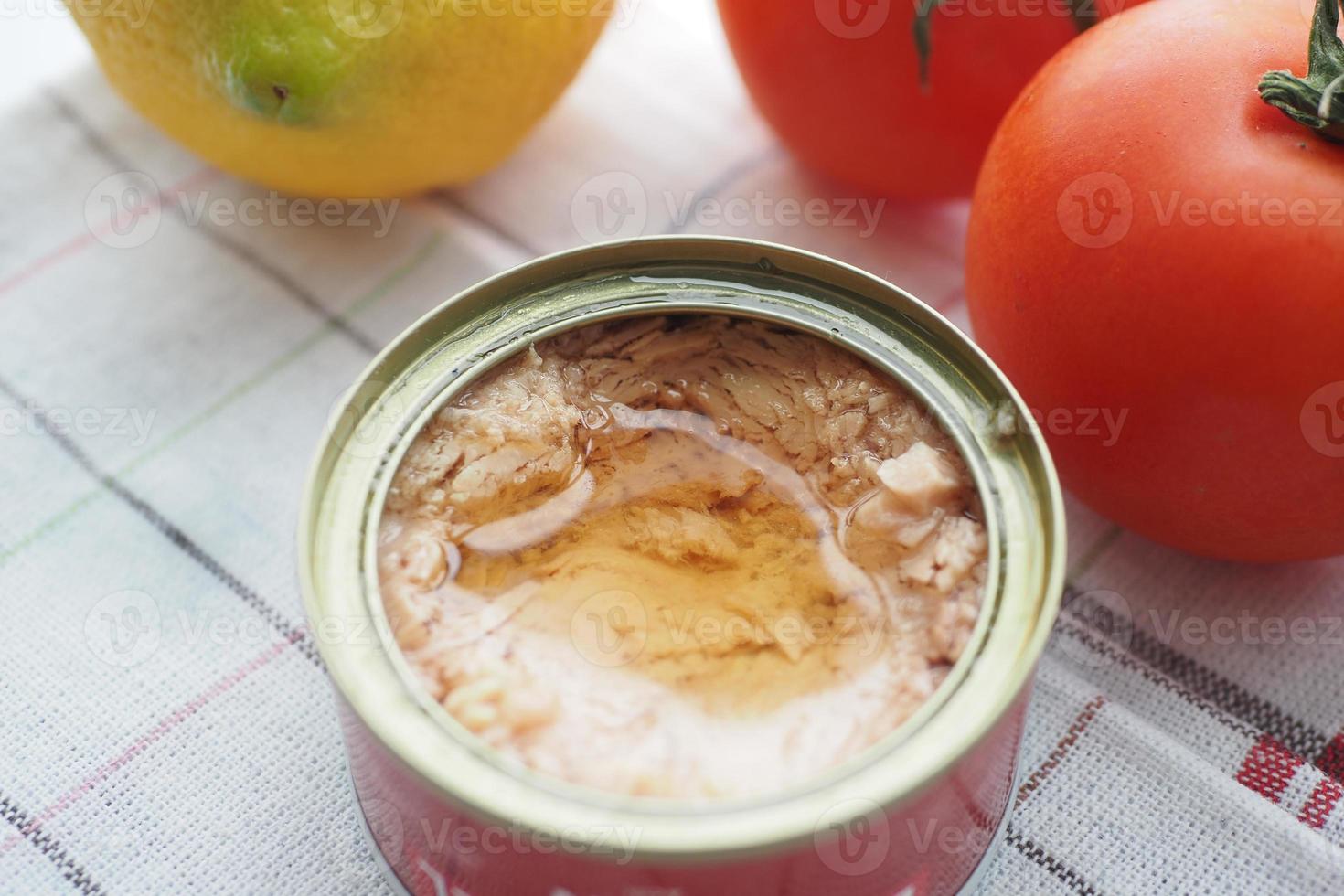 canned tuna on wooden table , photo