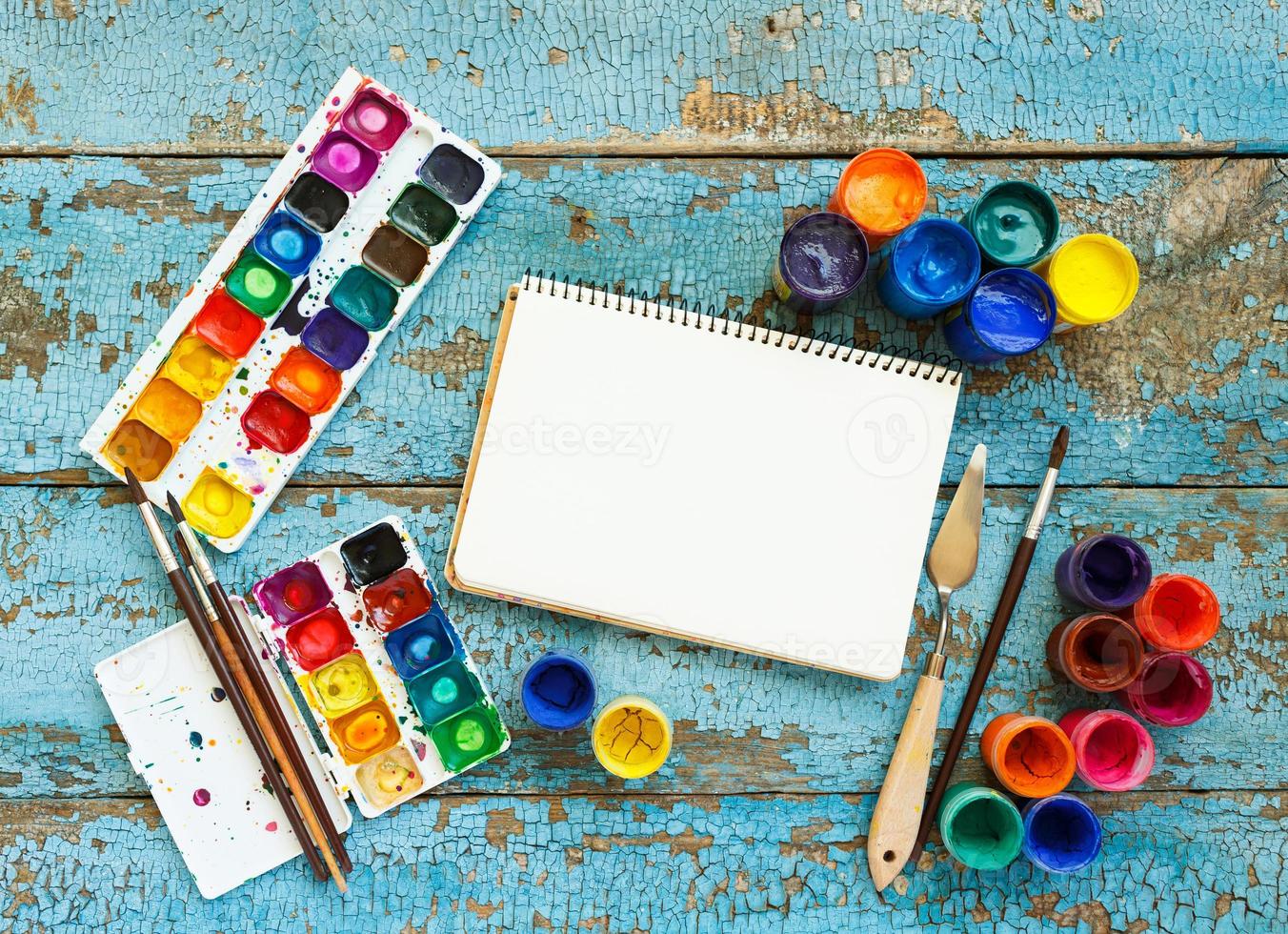 Art painting materials on wooden background photo