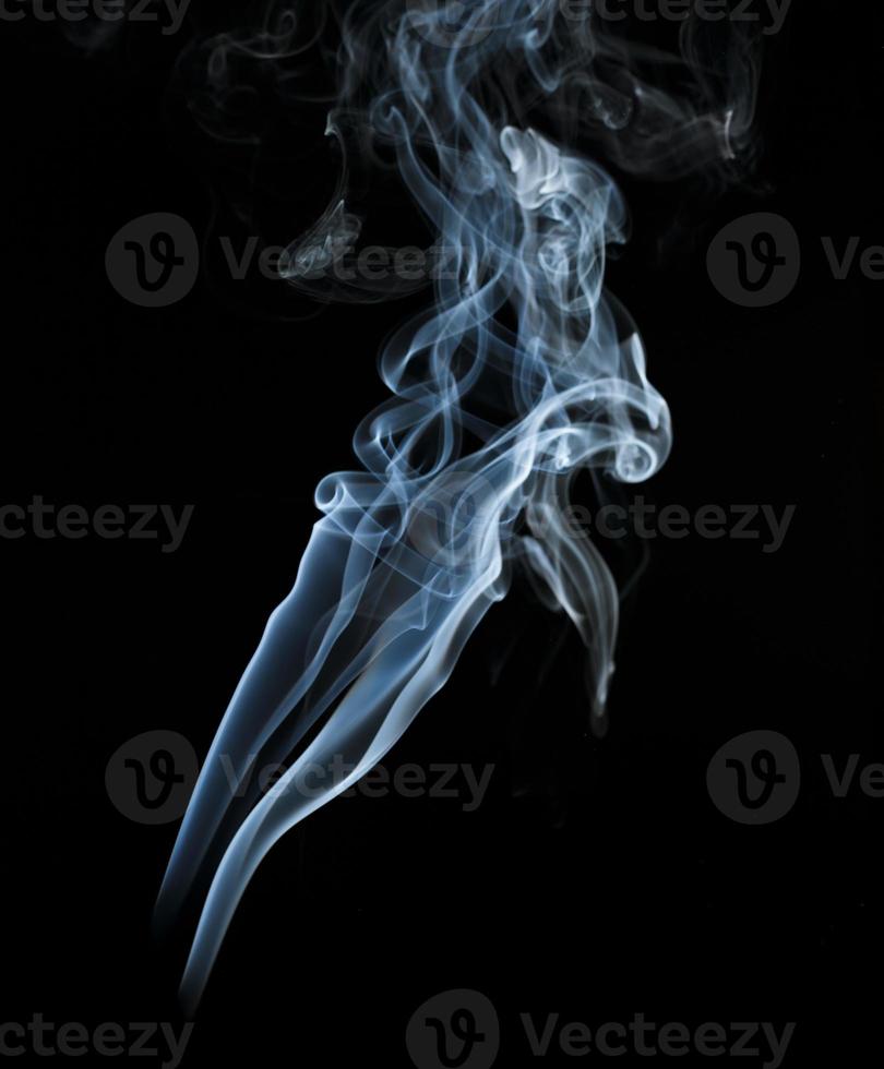 Abstract light smoke on dark background photo
