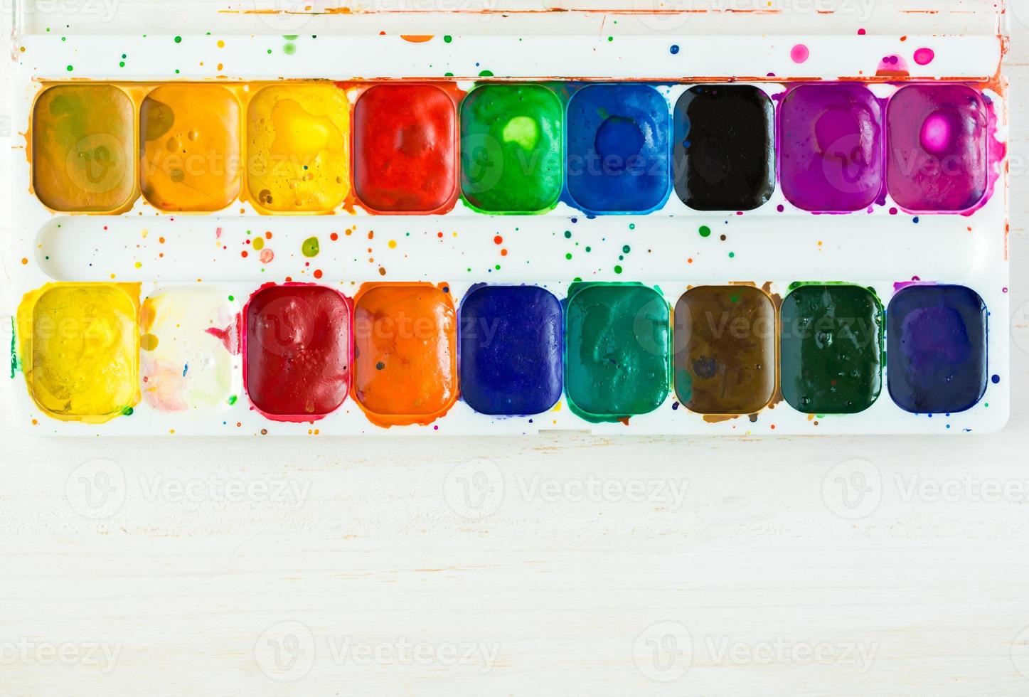 Used watercolor paint box top down view photo