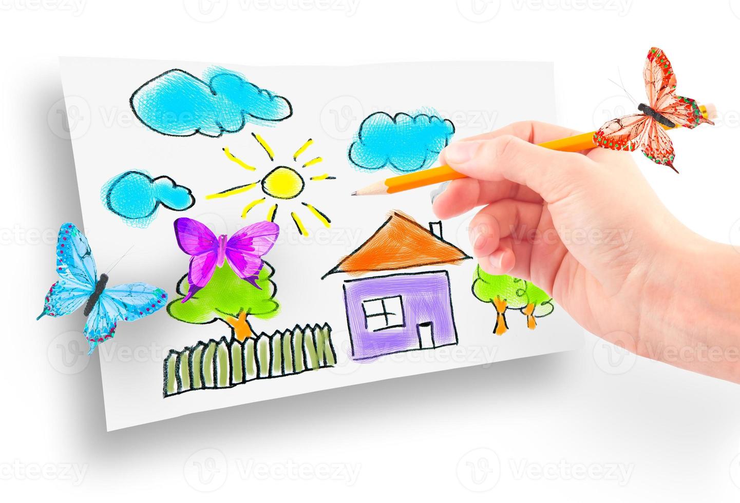 Woman's hand drawing the dream home photo