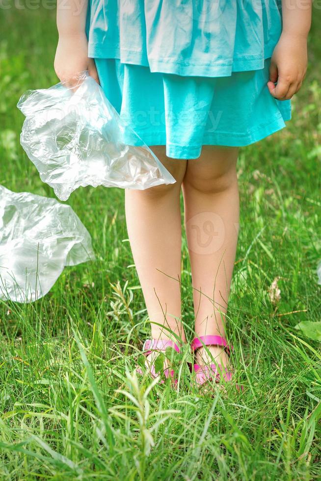 Plastic bag in little hands photo