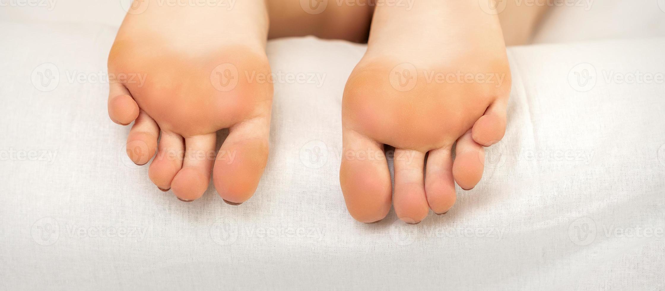 Soles of a young woman photo