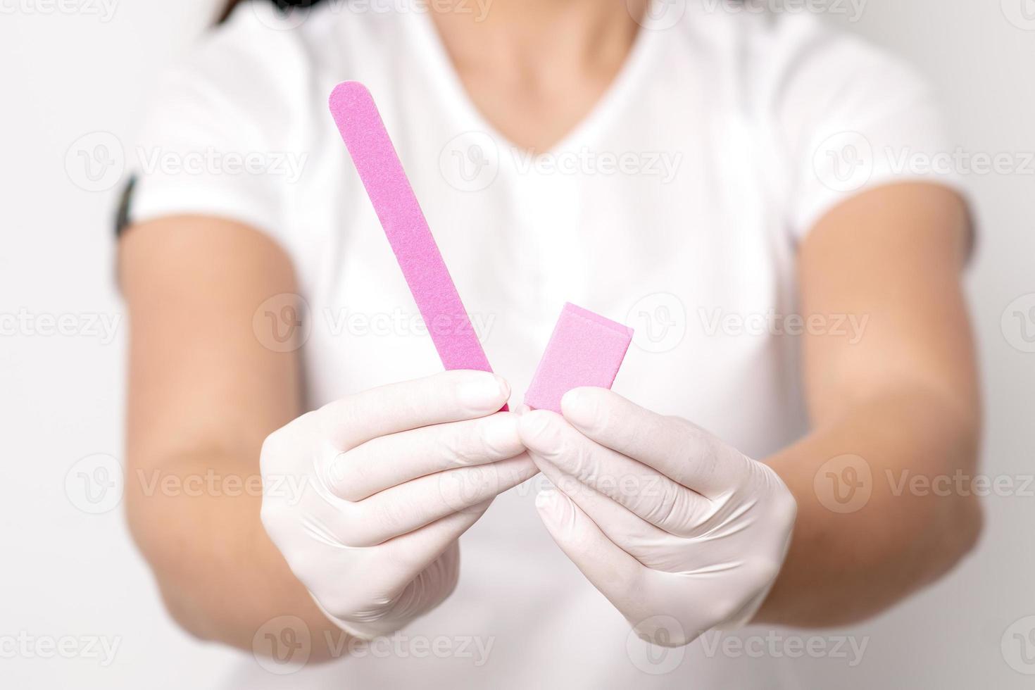 Manicure tools in hands of manicurist photo