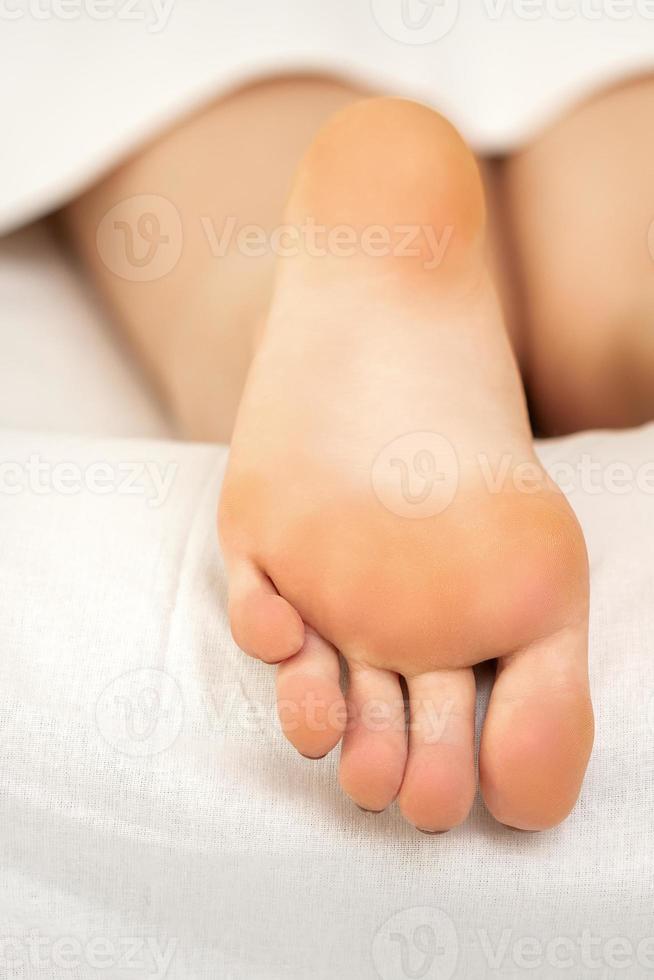 Soles of a young woman photo