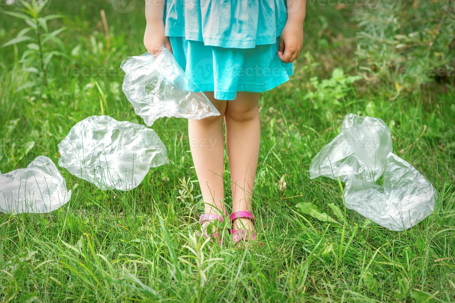 Plastic bag in little hands photo