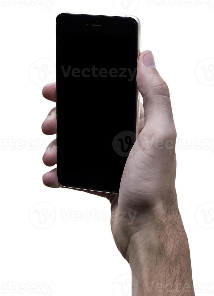 Male hand holding black cellphone with black screen at isolated white background. photo