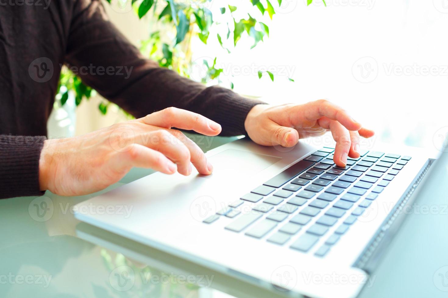 Men office worker typing on the keyboard photo