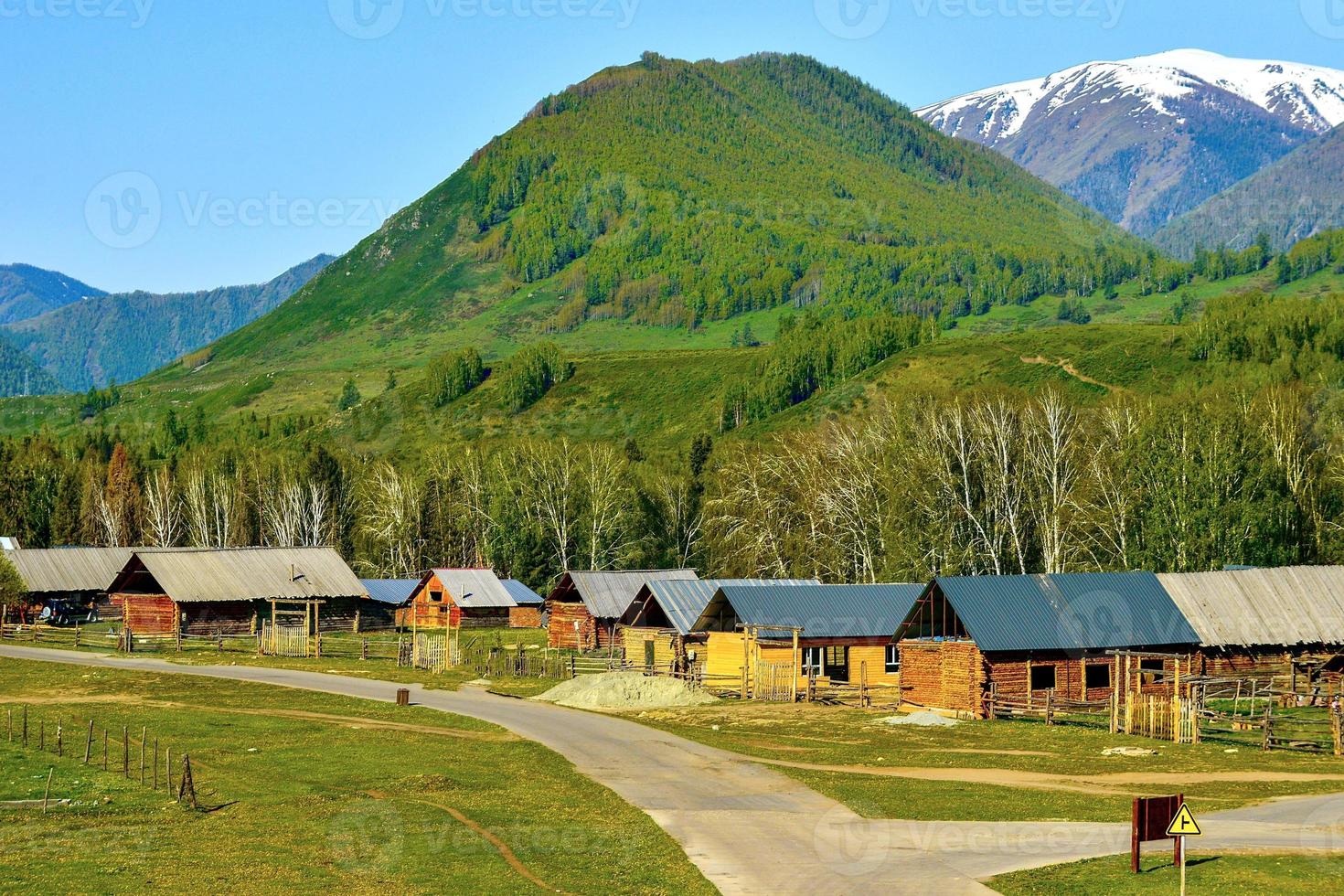 Hemu Village in Xinjiang is like a fairyland, the traditional and simple wooden houses are peaceful and isolated from the world photo