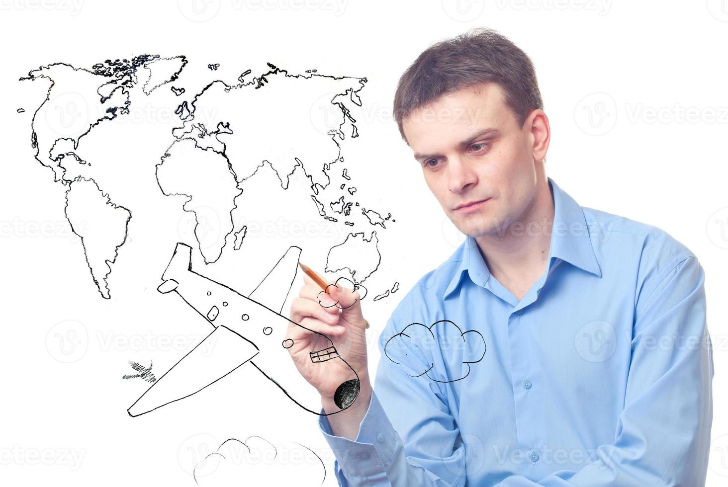 Businessman drawing plane and world map photo