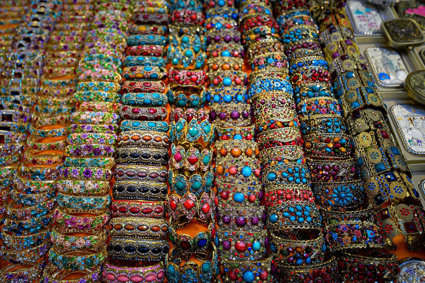 Uighur women's traditional and colorful bracelet jewelry on a vendor in the Grand Bazaar in Urumqi, Xinjiang, China photo