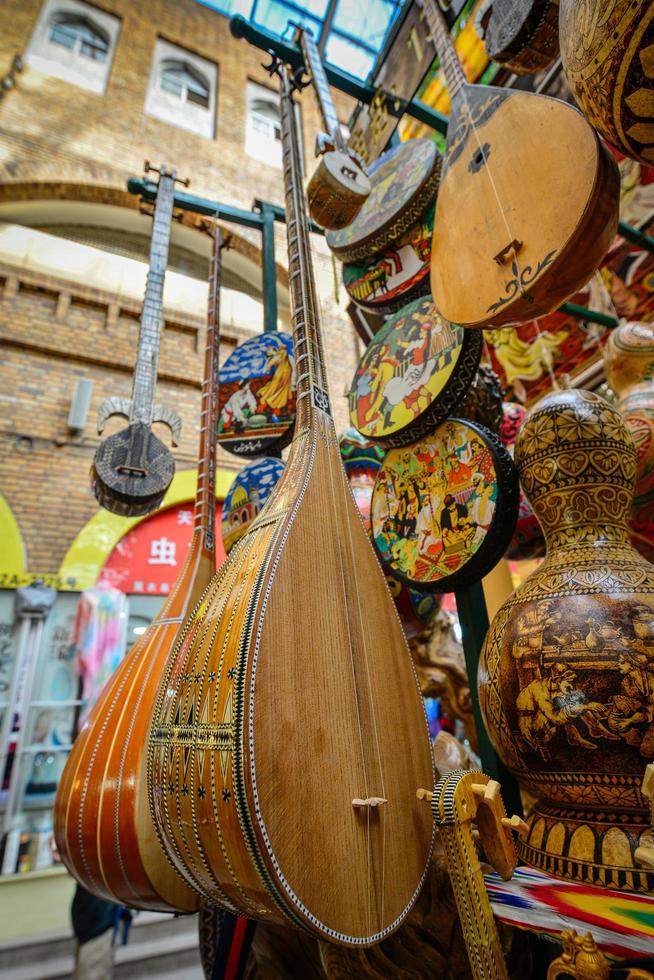 Vendors selling dutar in Grand Bazaar, Xinjiang, China photo