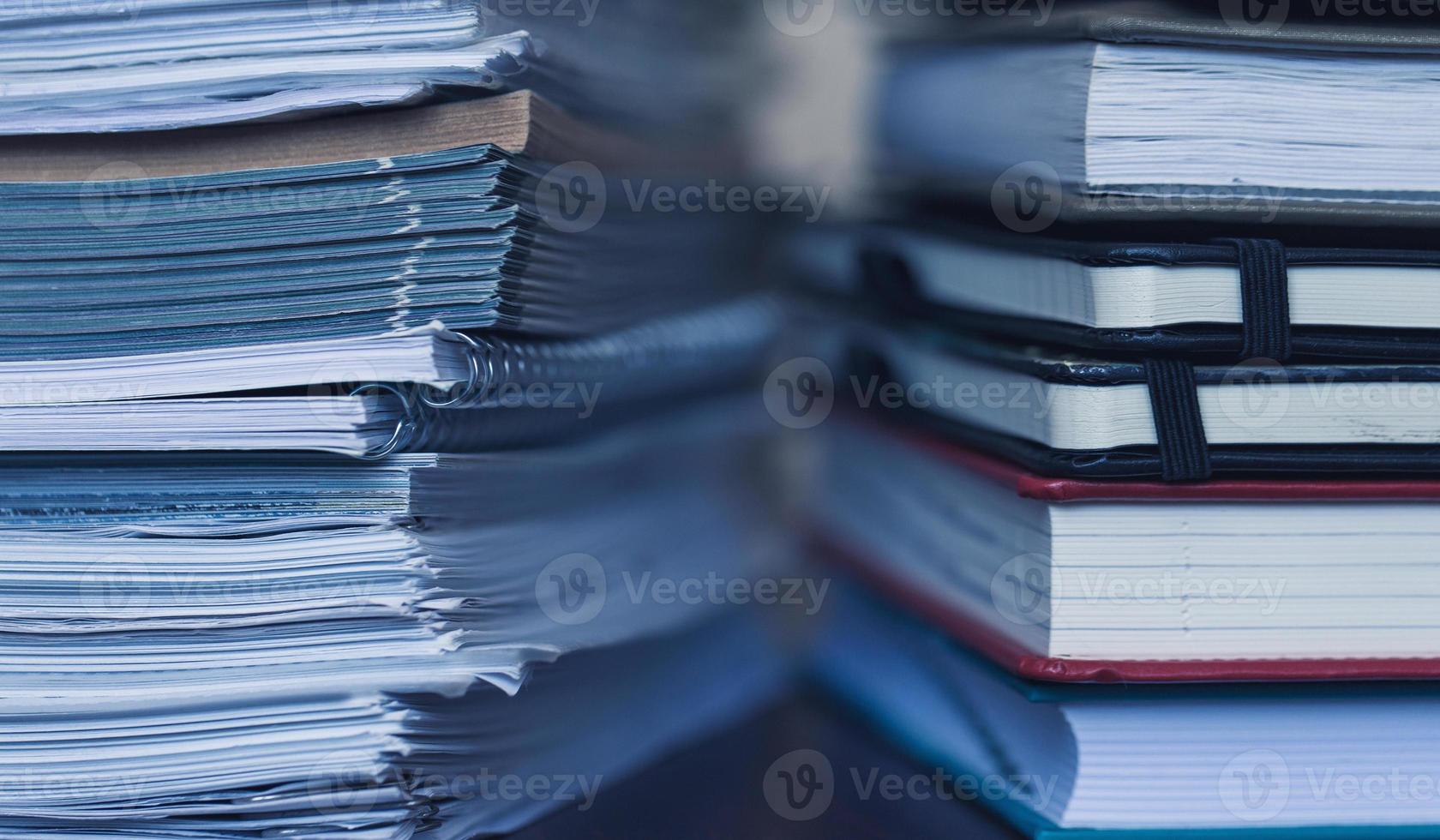 Accounting and taxes. Large pile of magazine and books photo