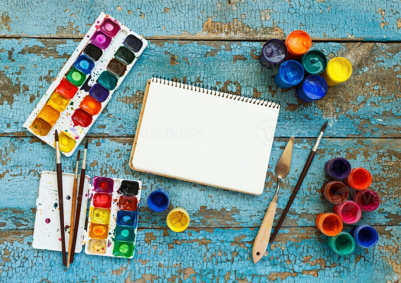 Art painting materials on wooden background photo